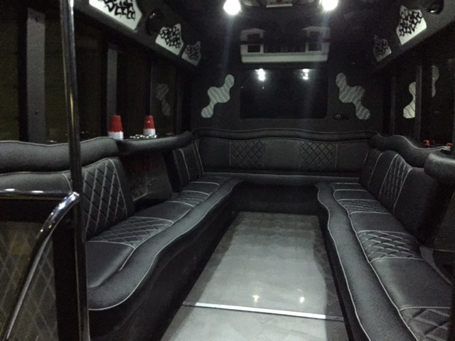 Interior picture of 22 passenger limo bus showing luxury leather seats